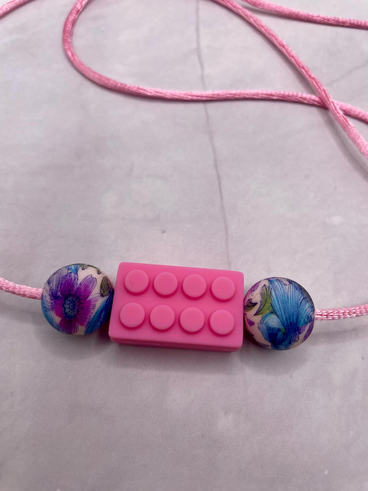 Jouet de dentition puzzle; PENDENTIF - EN FORME DE LEGO FLEURAL  FDMT ORAL MOTEUR